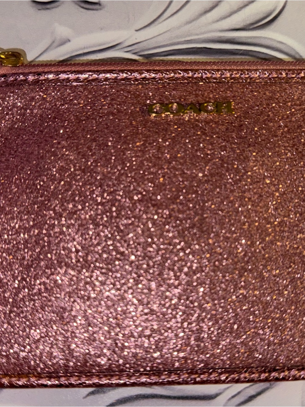 Coach glitter wristlet wallet in a rose gold